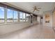 Bright sunroom with a ceiling fan, light, and large windows offering plenty of natural light at 7932 Ridge Pointe W Dr, Lakeland, FL 33810