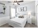 Bedroom featuring a panda-themed decor, a white bed frame, and natural light from the window at 867 Cypress Creek Run, St Cloud, FL 34771