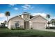 Charming single-Gathering home featuring a two-car garage, well-manicured lawn, and inviting curb appeal at 867 Cypress Creek Run, St Cloud, FL 34771