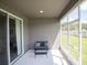 Enclosed patio with screened windows, a seating area, and a view of the outdoors at 867 Cypress Creek Run, St Cloud, FL 34771