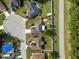 Aerial view showcasing the property's layout, landscaping, and location within the community at 8904 Pebblebrooke Dr, Lakeland, FL 33810