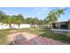 Lush backyard with a patio area, ideal for outdoor entertaining and relaxation at 8904 Pebblebrooke Dr, Lakeland, FL 33810