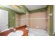 Bathroom featuring a tub and shower combo with green and tan tile at 8904 Pebblebrooke Dr, Lakeland, FL 33810