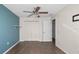 This bedroom has tile floors, a ceiling fan, and double closets for plenty of storage at 8904 Pebblebrooke Dr, Lakeland, FL 33810