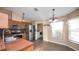 Modern kitchen with stainless steel appliances, ample cabinet space, and an adjacent dining area at 8904 Pebblebrooke Dr, Lakeland, FL 33810