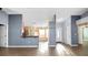 The living room offers ample space, neutral paint, and flows seamlessly to the kitchen at 8904 Pebblebrooke Dr, Lakeland, FL 33810
