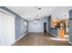 Spacious living room featuring tile floors, high ceilings, and a view into the kitchen at 8904 Pebblebrooke Dr, Lakeland, FL 33810