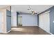 Tile floored living room that offers neutral colors, high ceilings, and natural light at 8904 Pebblebrooke Dr, Lakeland, FL 33810