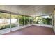 Screened patio featuring views of foliage in the backyard at 8904 Pebblebrooke Dr, Lakeland, FL 33810