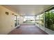A screened patio with views of a well-maintained, fenced backyard at 8904 Pebblebrooke Dr, Lakeland, FL 33810