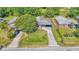 Aerial view of home with a well-manicured lawn and convenient carport in a suburban neighborhood at 1017 Fleming Ave, Lakeland, FL 33815