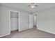 A sunlit bedroom with a built-in closet and neutral interior at 1017 Fleming Ave, Lakeland, FL 33815
