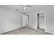 Neutral bedroom featuring plush carpeting, a closet and a door to the next room at 1017 Fleming Ave, Lakeland, FL 33815