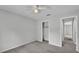A light-filled bedroom with neutral walls, carpeting, and a walk-in closet at 1017 Fleming Ave, Lakeland, FL 33815