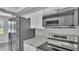 The kitchen offers stainless steel appliances, white cabinets, and granite countertops at 1017 Fleming Ave, Lakeland, FL 33815