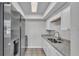 Modern kitchen featuring stainless steel appliances, granite countertops, and tiled floors at 1017 Fleming Ave, Lakeland, FL 33815