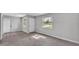 Bright living room with a window view, neutral paint, and flooring at 1017 Fleming Ave, Lakeland, FL 33815