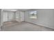 Living room with a seamless flow into the kitchen and an entry door on the right at 1017 Fleming Ave, Lakeland, FL 33815