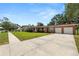Charming single-story brick home with a well-maintained lawn and an attached two-car garage at 111 E Orange St, Davenport, FL 33837