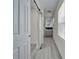 Bright bathroom with a sliding door, modern vanity, and window with blinds at 113 Patrick Henry Rd, Bartow, FL 33830
