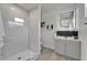 Modern bathroom featuring glass enclosed shower and vanity with LED mirror at 113 Patrick Henry Rd, Bartow, FL 33830