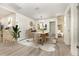 Dining room offers contemporary furnishing, a neutral color scheme, and wood-look flooring at 113 Patrick Henry Rd, Bartow, FL 33830