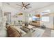 Inviting living room featuring neutral decor, comfortable seating, shelving, and windows for natural light at 113 Patrick Henry Rd, Bartow, FL 33830