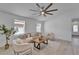Bright living area featuring stylish decor, comfortable seating, and a ceiling fan at 113 Patrick Henry Rd, Bartow, FL 33830