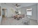 Cozy living room with neutral tones, plush seating, and a modern ceiling fan at 113 Patrick Henry Rd, Bartow, FL 33830