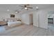 Open main bedroom with dual ceiling fans and attached bathroom at 113 Patrick Henry Rd, Bartow, FL 33830