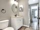 Bathroom featuring a modern vanity, neutral color scheme, and a tub at 1140 Stratton Ave, Groveland, FL 34736