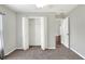 Open bedroom with carpeted floors, neutral paint, and a closet at 1140 Stratton Ave, Groveland, FL 34736