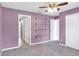 Bedroom featuring a modern design, shelves, and access to an ensuite bathroom at 1140 Stratton Ave, Groveland, FL 34736