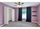Cozy bedroom with ample natural light and double-door closet at 1140 Stratton Ave, Groveland, FL 34736