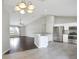 View of open concept with eat-in kitchen, living room and stainless appliances at 1140 Stratton Ave, Groveland, FL 34736