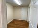 Bright bedroom boasts wood floors, neutral paint, and plenty of natural light at 1167 Motorcoach Dr, Polk City, FL 33868