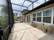 Spacious screened-in patio with tile flooring and lots of room for entertaining at 1167 Motorcoach Dr, Polk City, FL 33868