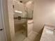 Main bathroom features a glass-enclosed tiled shower with a built-in bench at 1167 Motorcoach Dr, Polk City, FL 33868