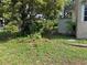 Landscaped backyard with storage shed, offering functionality and outdoor space at 1215 E Edgewood Dr, Lakeland, FL 33803