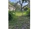 Backyard with lush lawn and secure fencing, offering privacy and a safe outdoor space at 1215 E Edgewood Dr, Lakeland, FL 33803