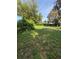Expansive backyard offering green space and mature trees, perfect for outdoor activities and relaxation at 1215 E Edgewood Dr, Lakeland, FL 33803