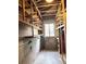 Unfinished basement with built-in shelving and a window providing natural light; ready for customization at 1215 E Edgewood Dr, Lakeland, FL 33803