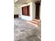 A large, bright room with built-in cabinets and unique steps to the side at 1215 E Edgewood Dr, Lakeland, FL 33803
