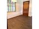 Bright room with light from the window and new wood-look flooring at 1215 E Edgewood Dr, Lakeland, FL 33803
