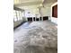 Large room with a chimney and built in shelving and cabinets at 1215 E Edgewood Dr, Lakeland, FL 33803
