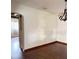 Open living area featuring gleaming hardwood floors, arched doorways, and classic details, providing a versatile space at 1215 E Edgewood Dr, Lakeland, FL 33803