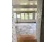 Enclosed porch with concrete floor and many windows for natural light at 1215 E Edgewood Dr, Lakeland, FL 33803