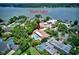 Aerial view of a lovely home with a pool and patio, in a beautiful, lake-adjacent, residential area at 1235 Lake Point Dr, Lakeland, FL 33813