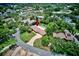 An aerial view of an attractive home, surrounded by lush trees and landscaping at 1235 Lake Point Dr, Lakeland, FL 33813
