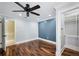 Comfortable bedroom featuring hardwood floors, recessed lighting, and closet storage at 1235 Lake Point Dr, Lakeland, FL 33813